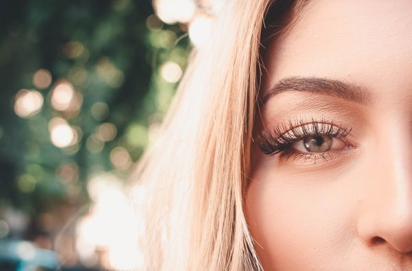Natural mink lash extensions on a green eye